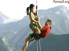 Adventurous Couple Hangs By Ropes From A Cliff Fucking And Sucking In The Outdoors