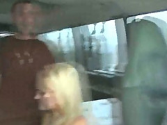 Blonde chick fucks two guys in a van